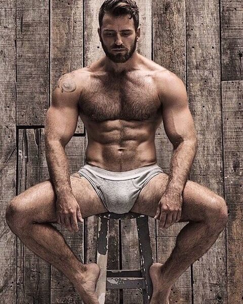 Man Spreading Behind the Barn