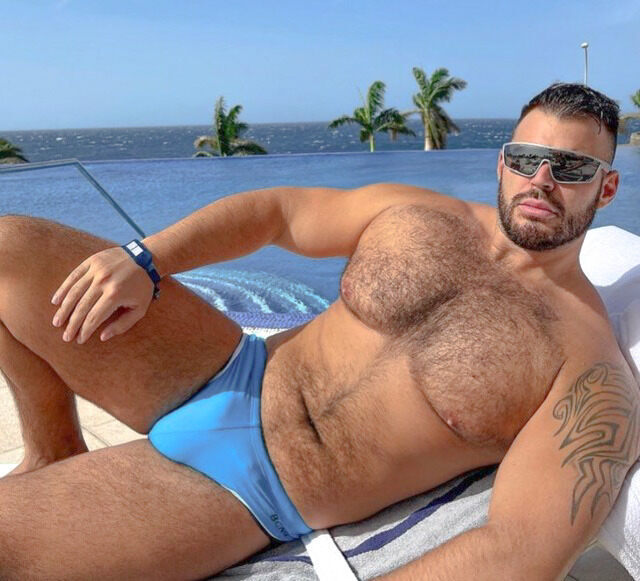His hairy chest lounging  in the tropics
