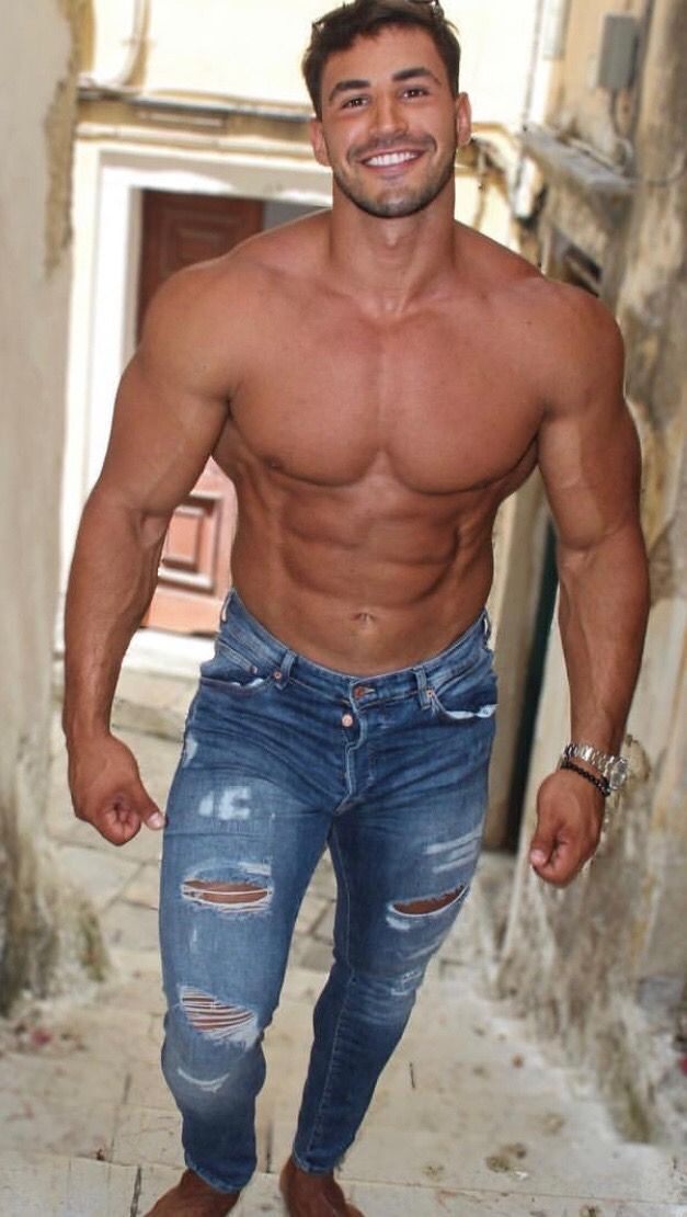 Ripped guy wearing ripped jeans!   And BTW the smile and teeth are perfect!
