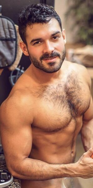 Lean muscle - trimmed beard - hairy - sly smile