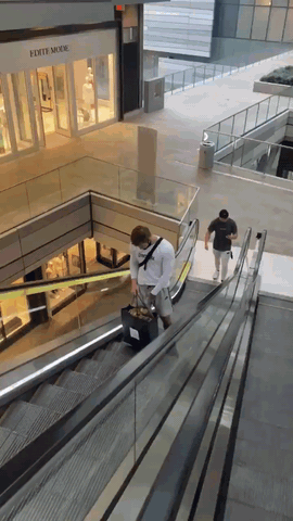 Getting an extra thrill riding the escalator.