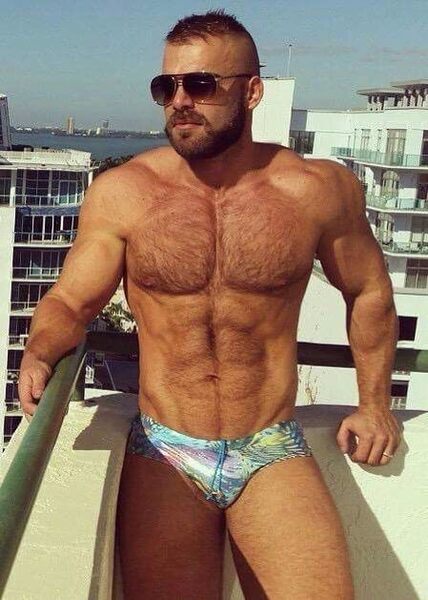 It should be illegal to wear any sort of swimwear that covers more of the body when one looks like this guy!