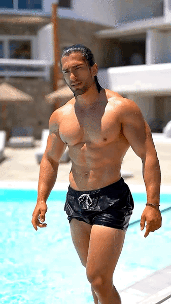 Poolside Adonis strutting his stuff.