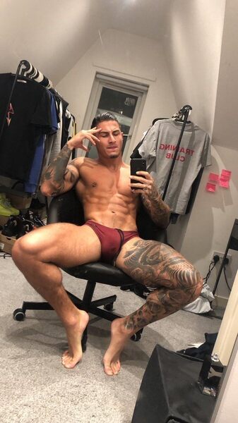 How to describe this,.. spreading, bulge, tatts, nip piercings,  muscle… did I miss anything…