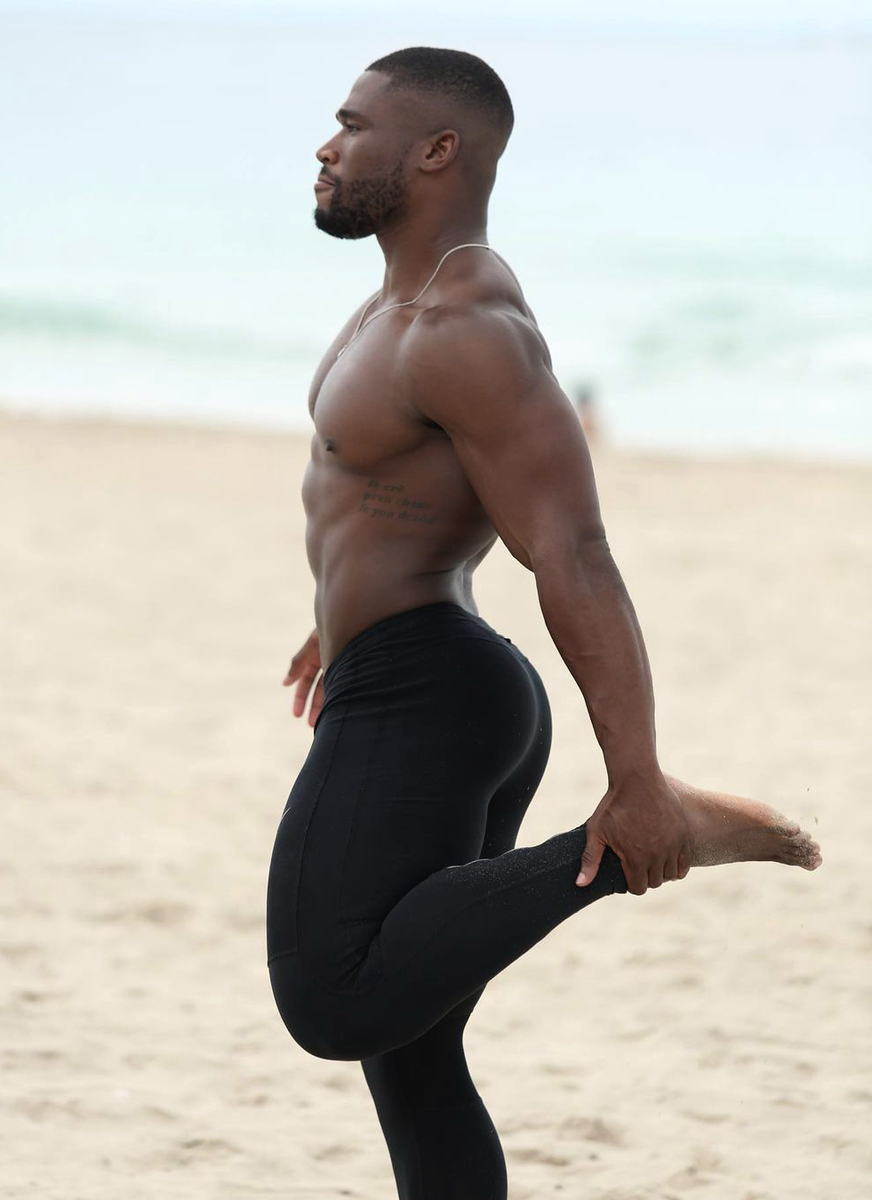 The gorgeous Pierre Vuala stretching on the beach