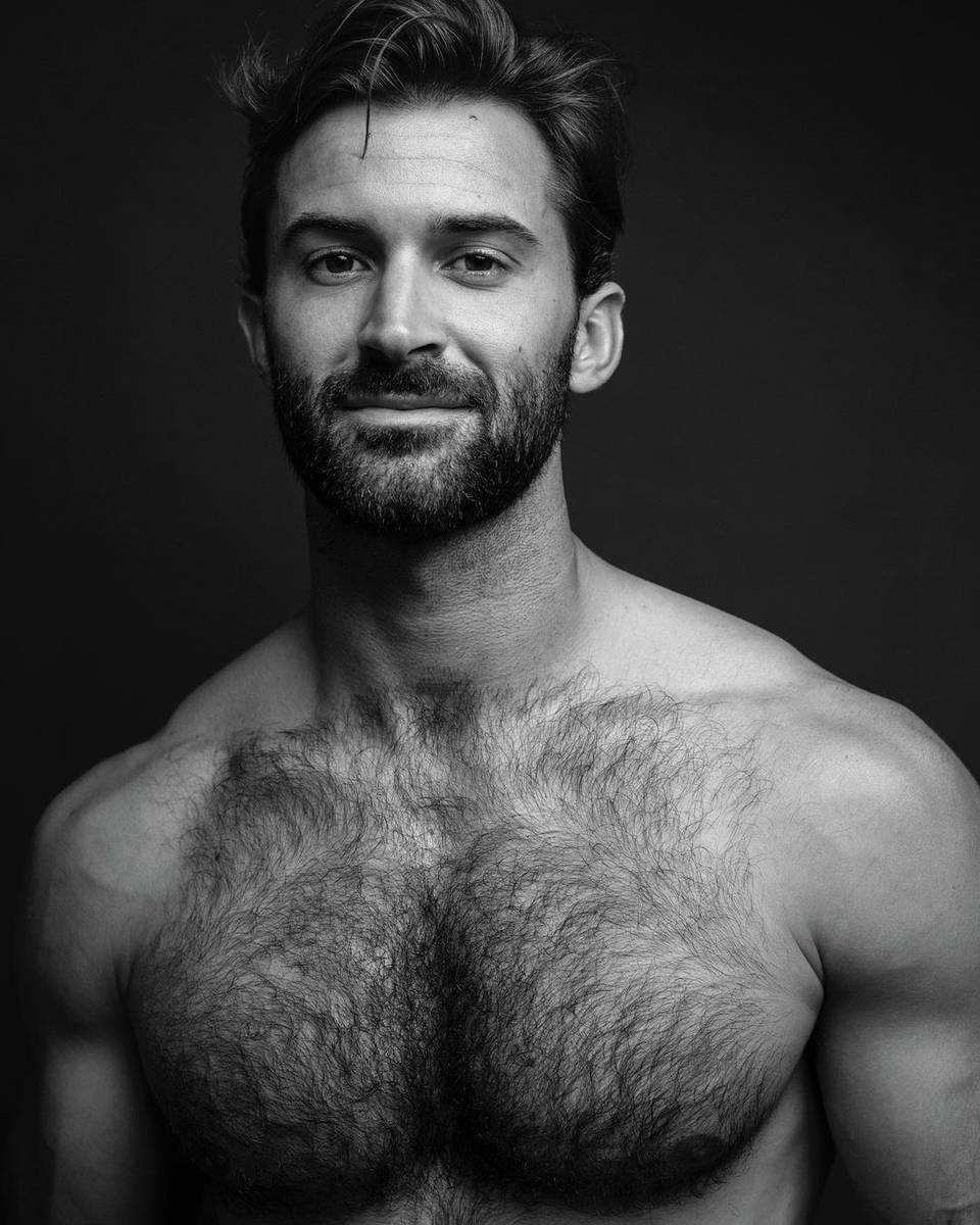 His hairy chest and enigmatic smile