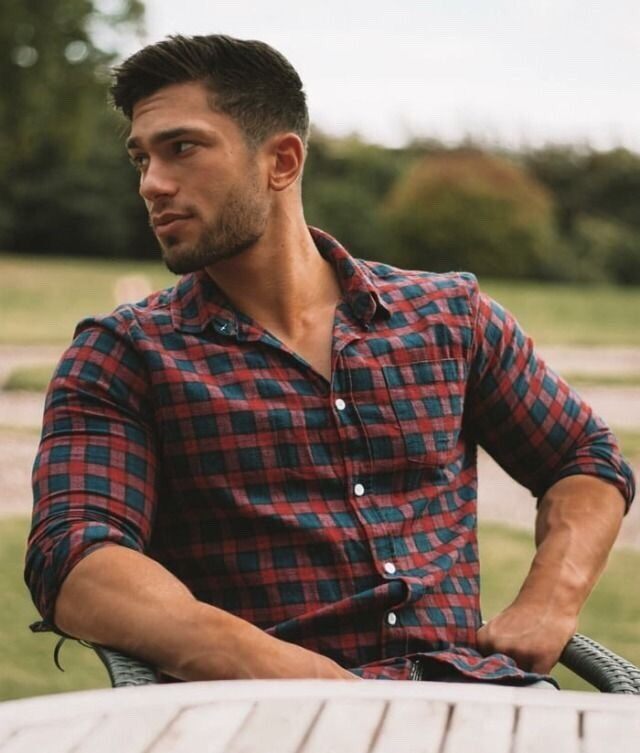 Hot even wearing a plaid shirt!