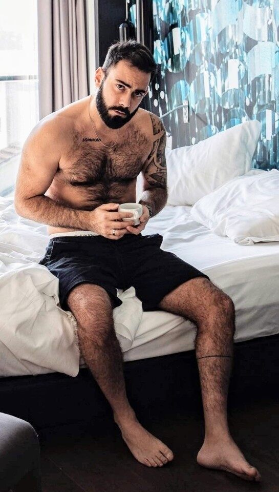Coffe time on the edge of the bed