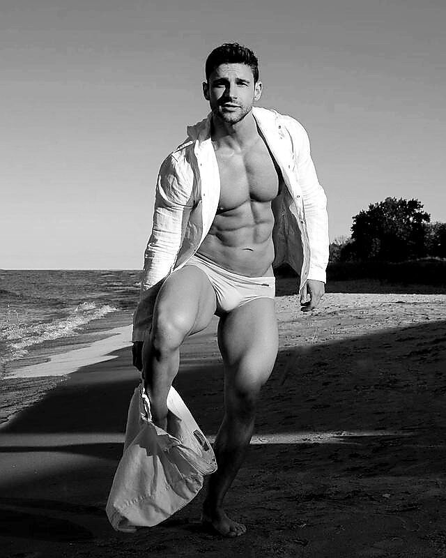 Undressing on the beach… and YES!  The hot thighs complete the package!