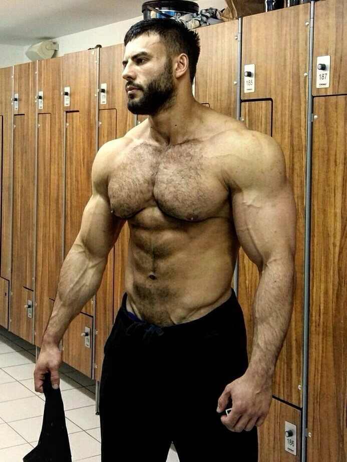 In the locker room waiting for  someone to worship his chest…