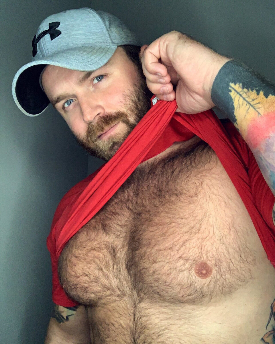 Giving a peek of his hairy chest