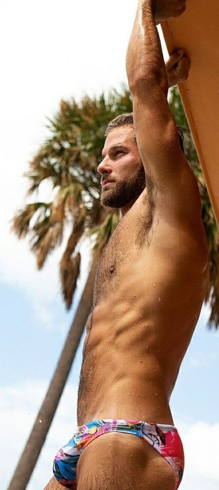 He wears that teeny bikini quite well…