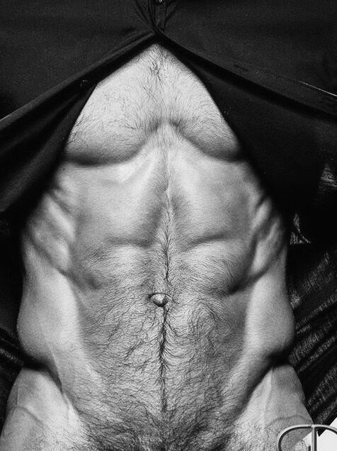 Unbuttoned torso… and with a tease.