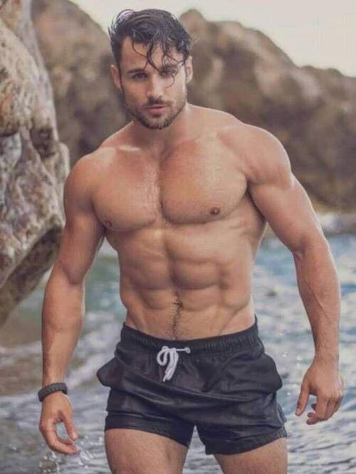 Wading near the rocks.