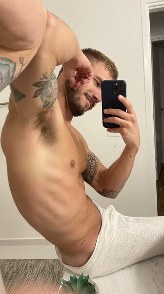 On the floor leaning against the mirror on the wall…