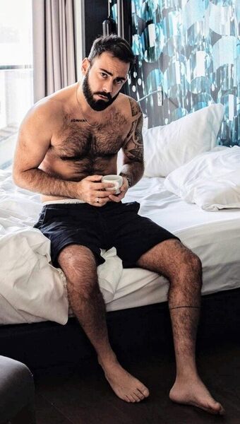 Coffe time on the edge of the bed