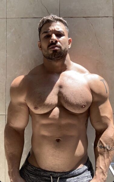Big guy with nicely sculpted chest, delts, and arms…