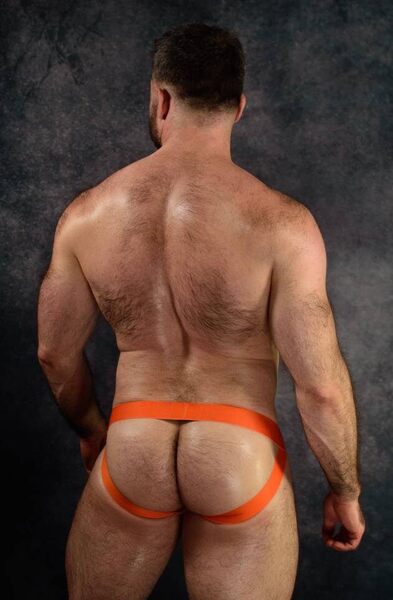 His muscle butt framed in orange