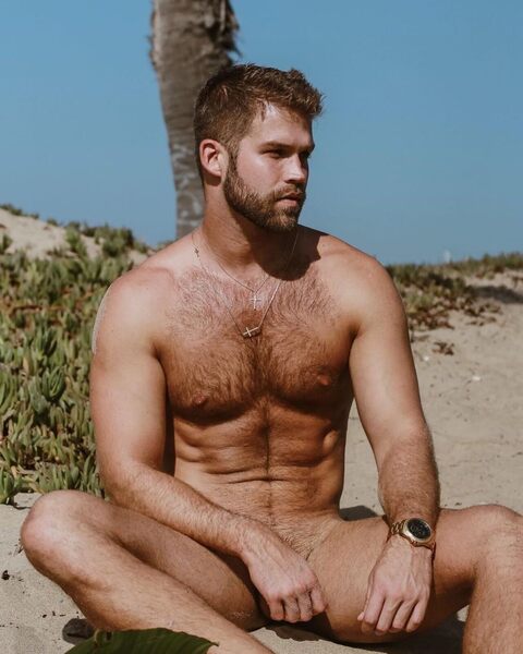 Nude dude sitting on the dunes.