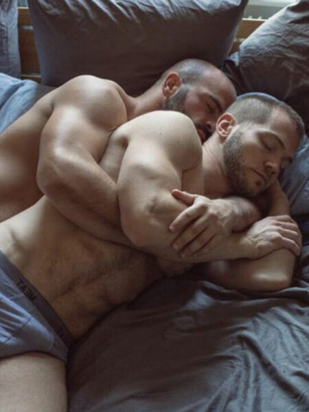 Big muscle couple in a cuddling sleep