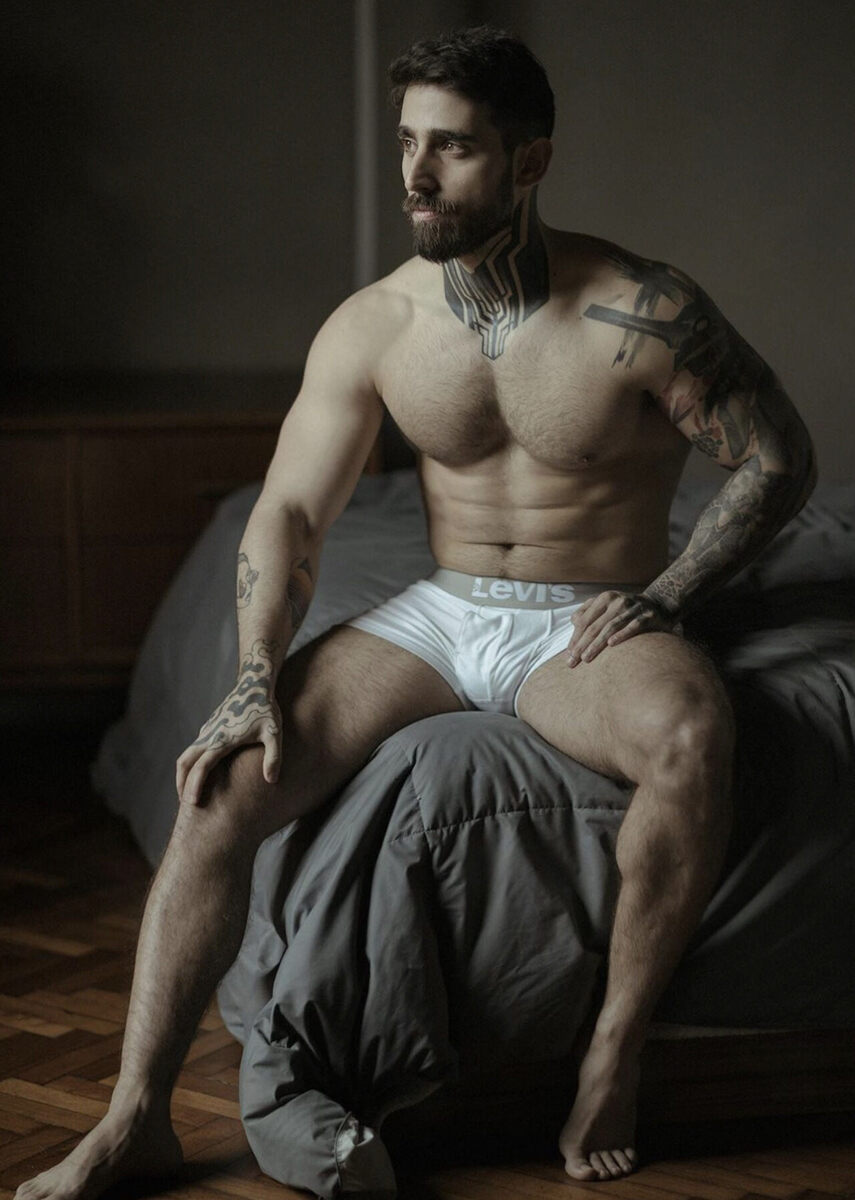 On the corner of the bed