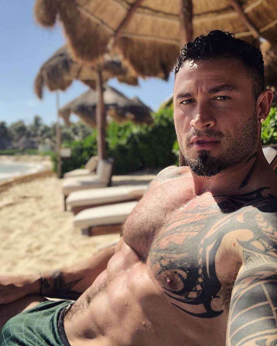 Big muscle relaxing on the beach…