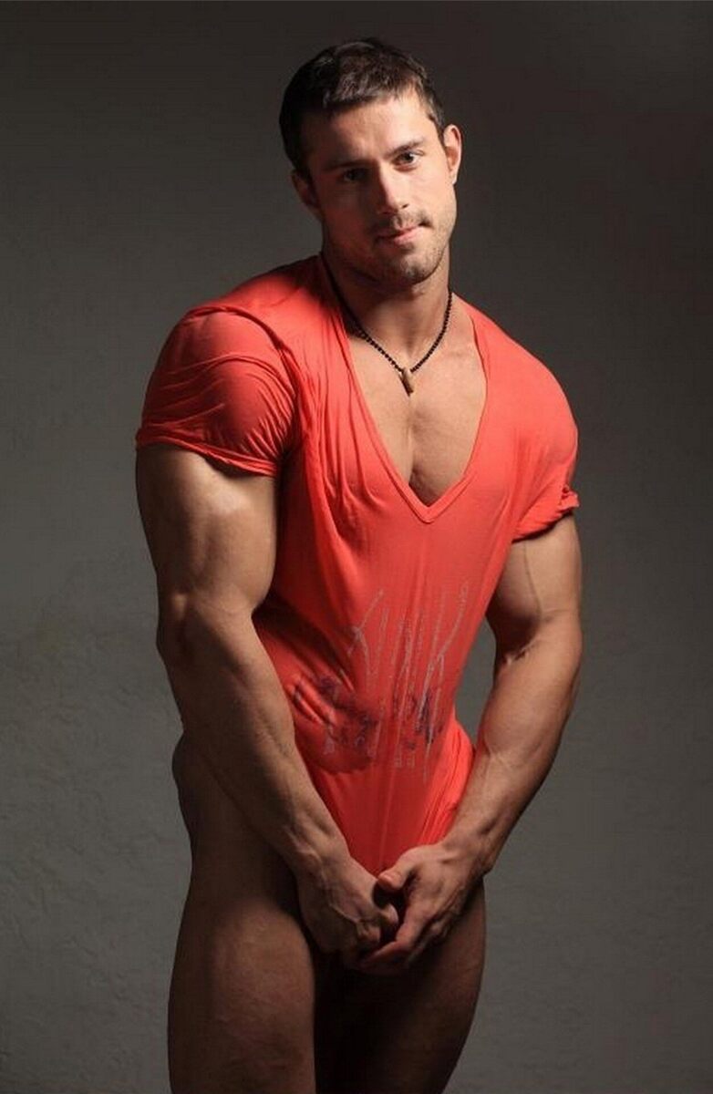 His sexy arms pulling his shirt down…