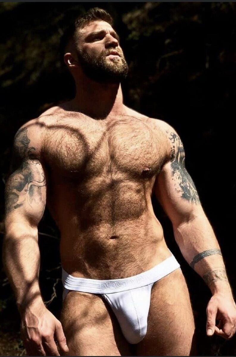 Hairy brawny stud packing some juicy meat in that jock!