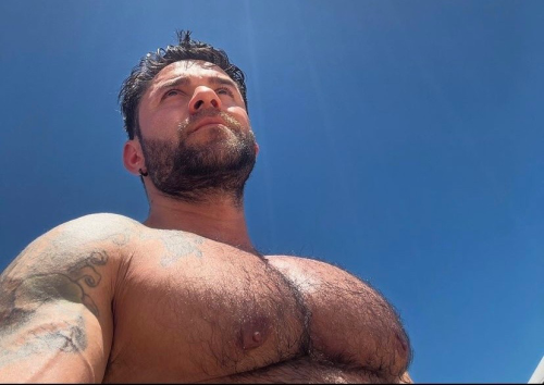 Highlighting his hairy chest