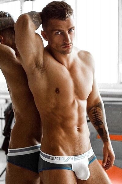 Leaning against the mirror mirror on the wall.