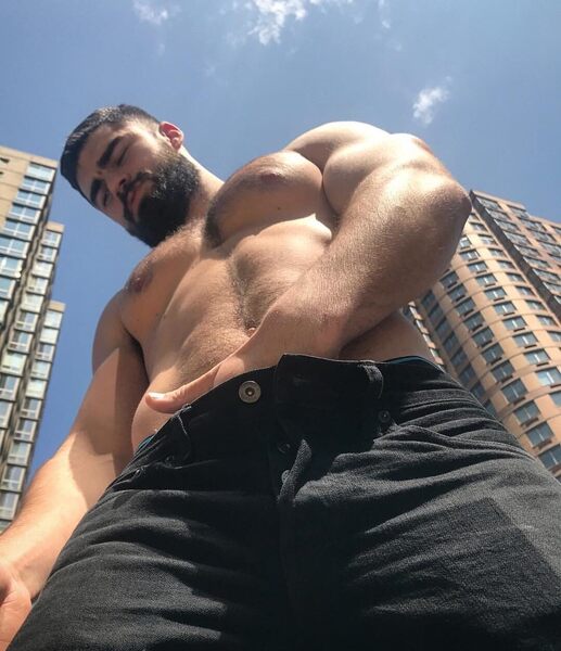 Standing tall with a hand in his pants
