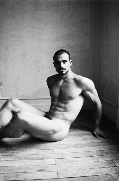 On the floor in the corner
