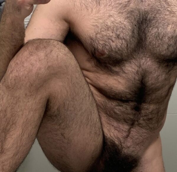 Hairy torso with a leg up