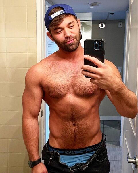 Cap backwards with just a hint of a smile