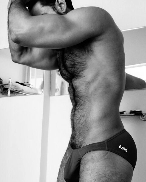 His low rise nicely filled black bikini that’s begging to be removed