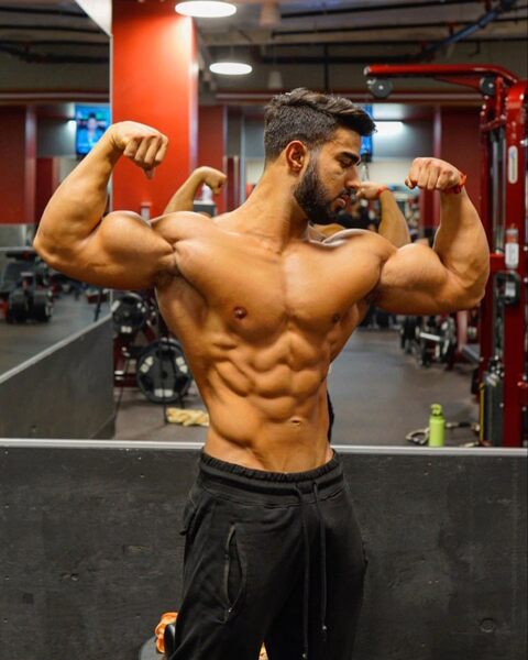 Showing off his guns… and more!