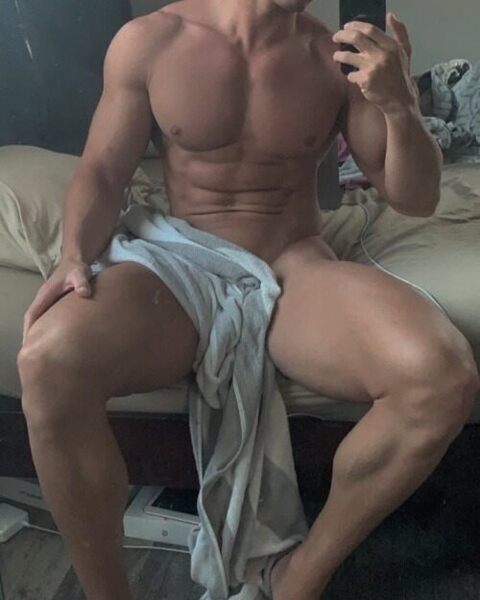 His on the edge of the messy bed selfie