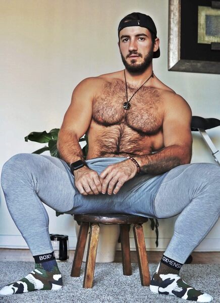 Man spreading in sweats