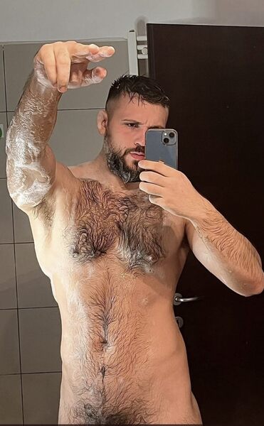 Signaling that he just dropped the soap and want you to pick it up…