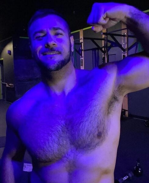 Hot guy in purple lighting
