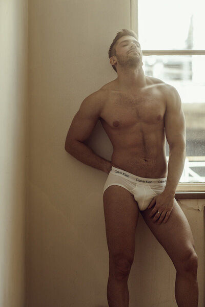 Leaning against the wall with those nicely bulging Calvins