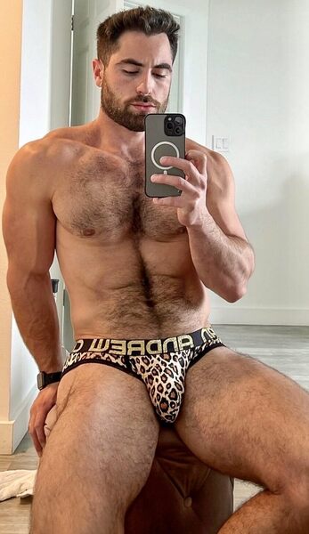Gets his kicks by tsking pics of his bulge and then posting them online.