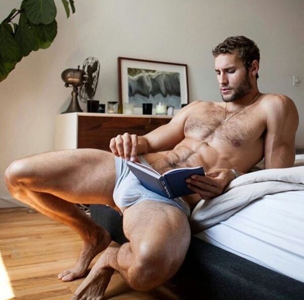 Don’t worry!  He ain’t reading a “how to” sex manual.  He wrote the book on that!
