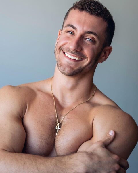 If you saw the size of the dildo that is up his butt you would know why he is smiling!