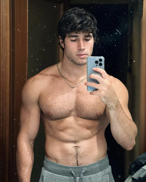 Posts his pics as “digital hunk”