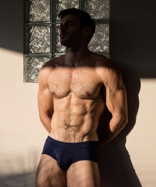 Highlighting his black briefs