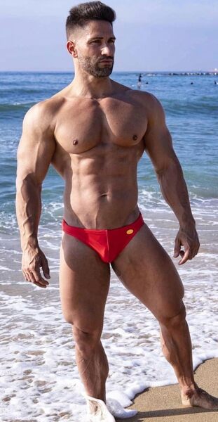In his red Speedo®️on the beach