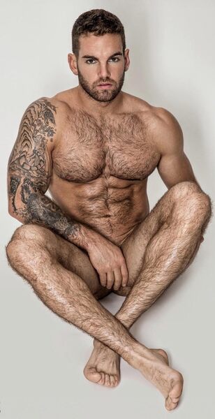 With his legs crossed and a not so well placed hand…