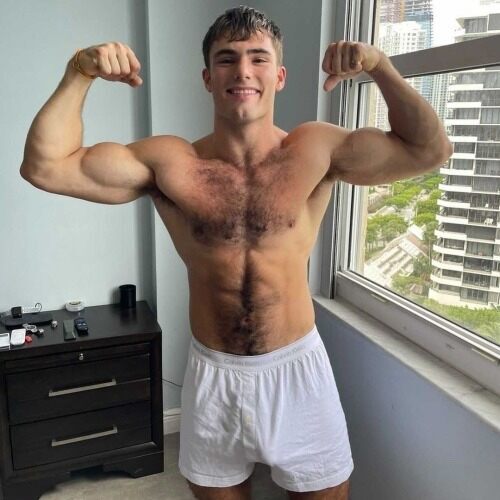 On close scrutiny his guns are not the only things he needs to show off!
