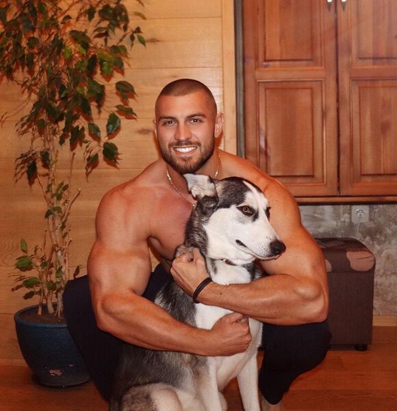 bald-sexy-shirtless-muscle-hunk-hugging-dog-pet.jpg
